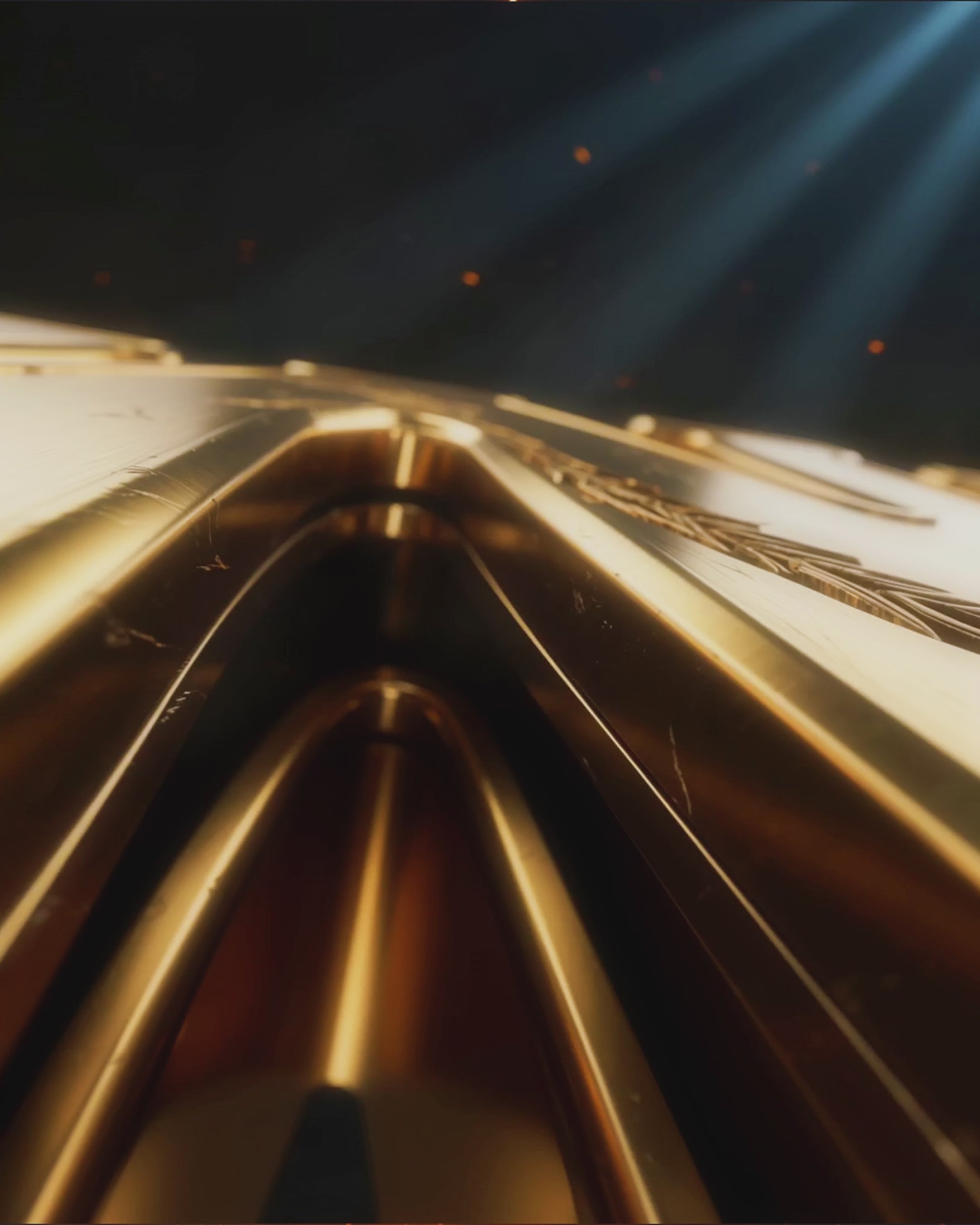 Still from a delivered motion flyer — cinematic gold light sweep